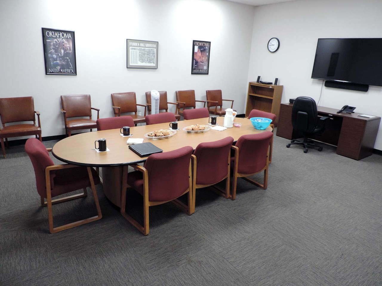 Conference or training room with available TV and tables/chairs.          