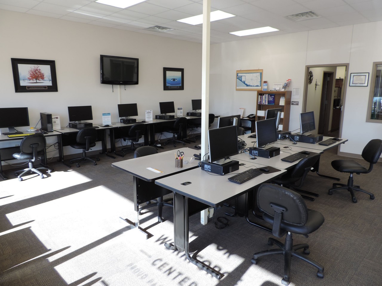 Resource area with computers and a printer/scanner/fax available to the public.