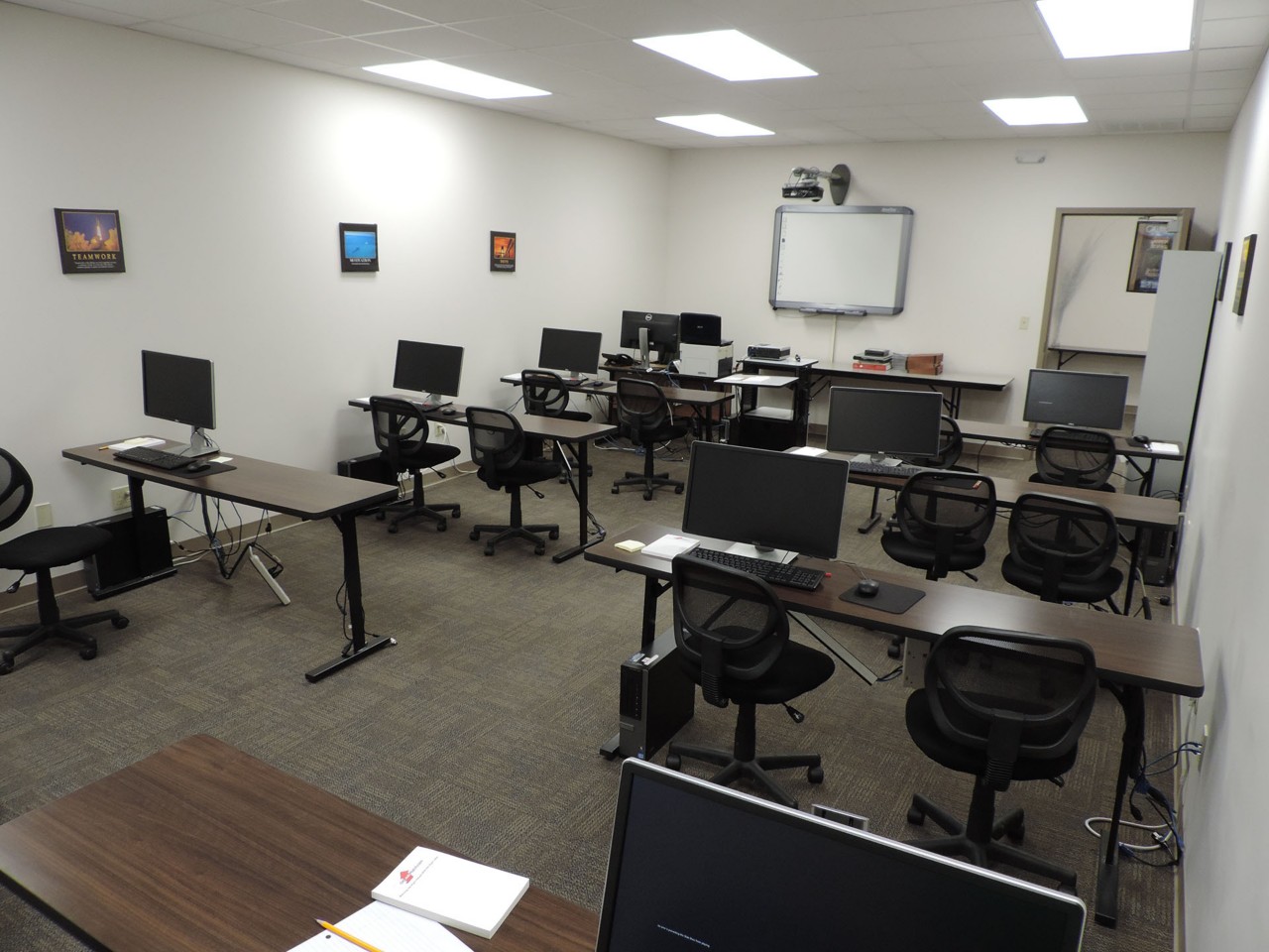 Training or testing room with available computers and smart board.