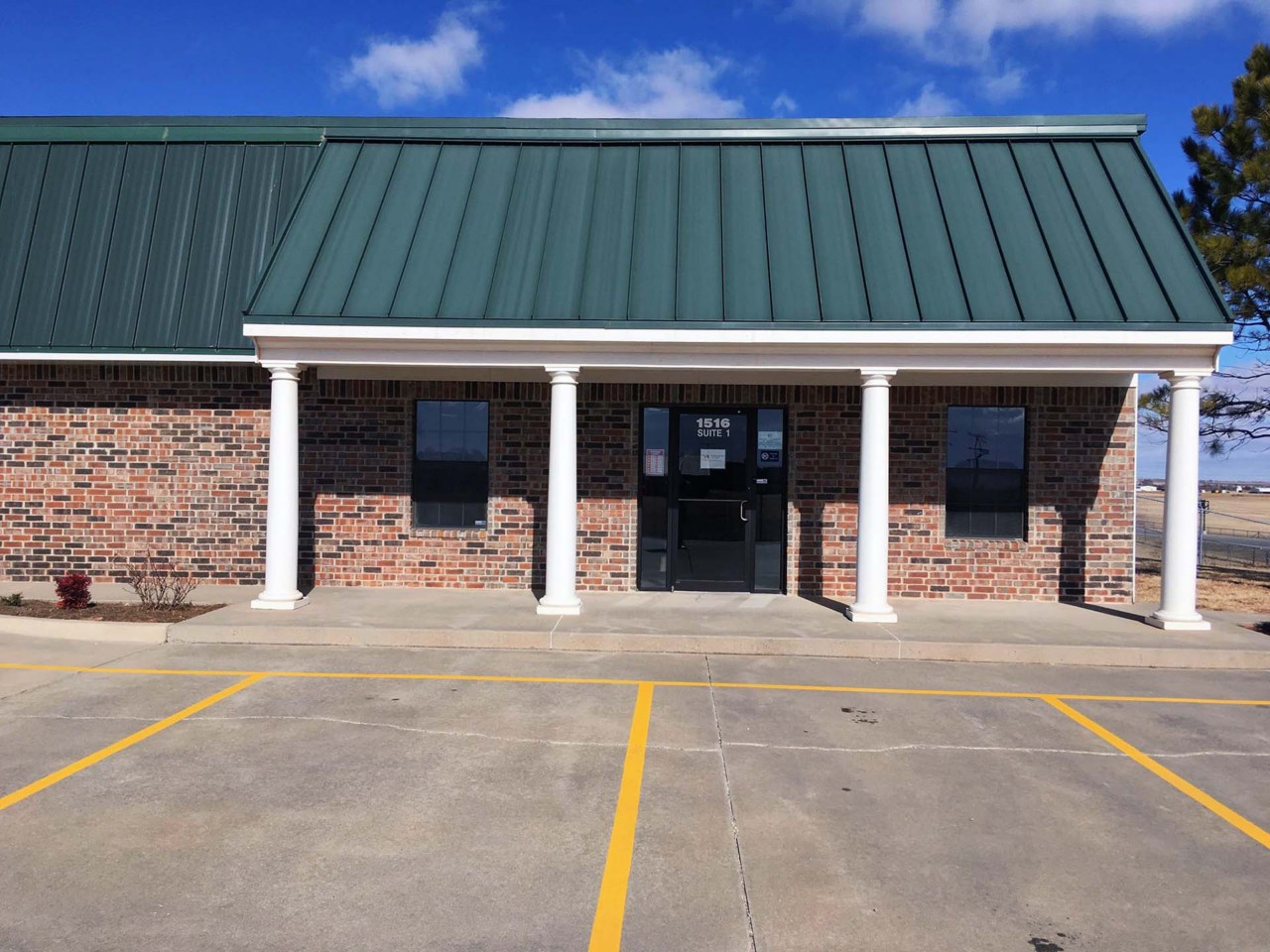 Office exterior view from the parking area.          