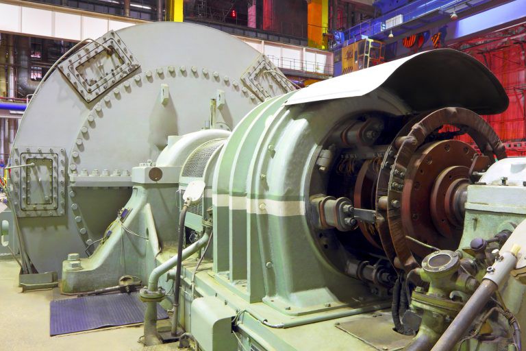 An image showing a turbine inside a power plant.