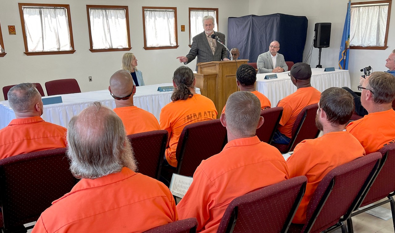 Senator Roger Thompson speaking to inmates