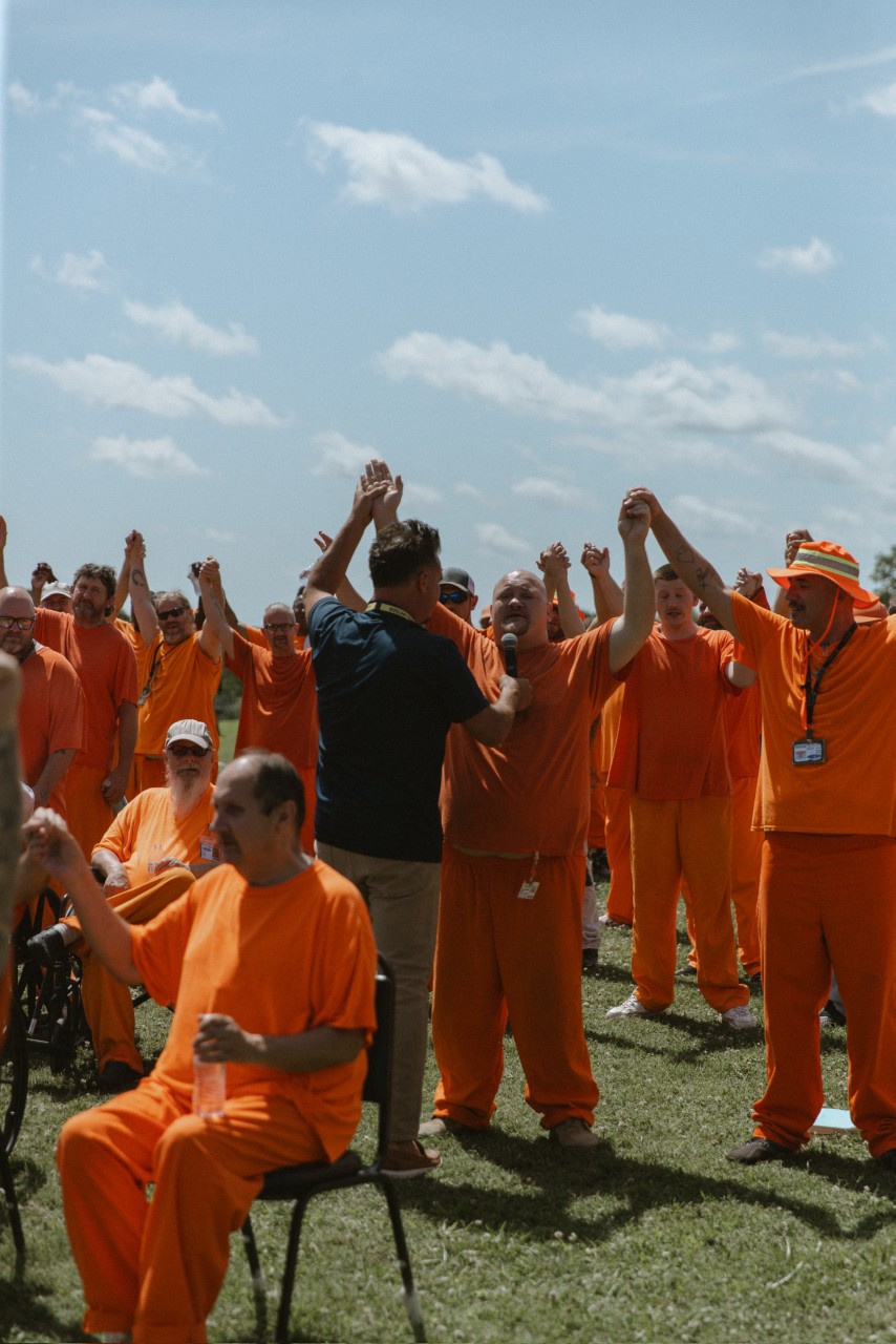Inmate lifting hands
