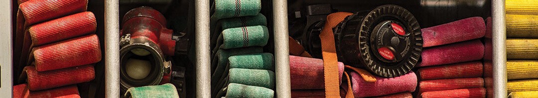 five fire hoses in storage