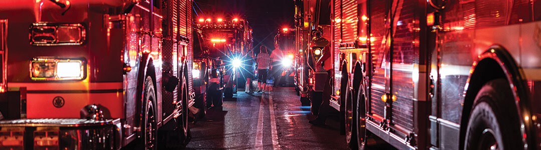 six fire vehicles at night