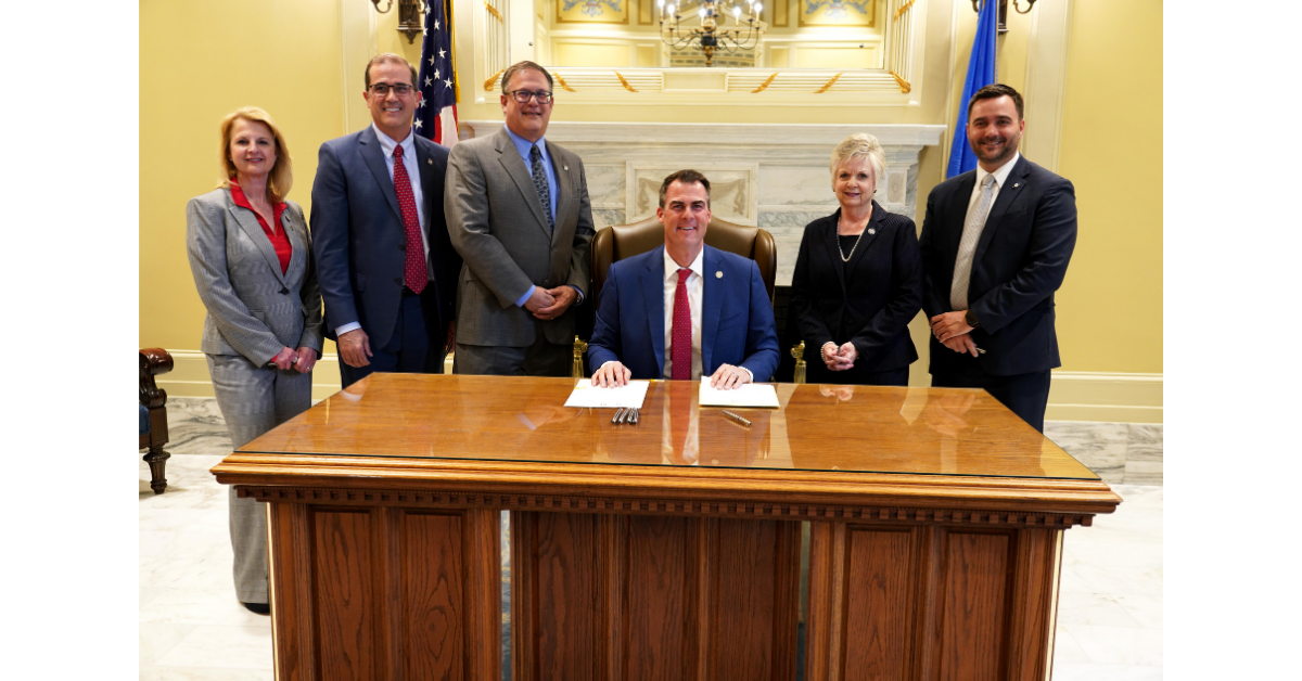 Gov. Stitt and state law makers at bill signing