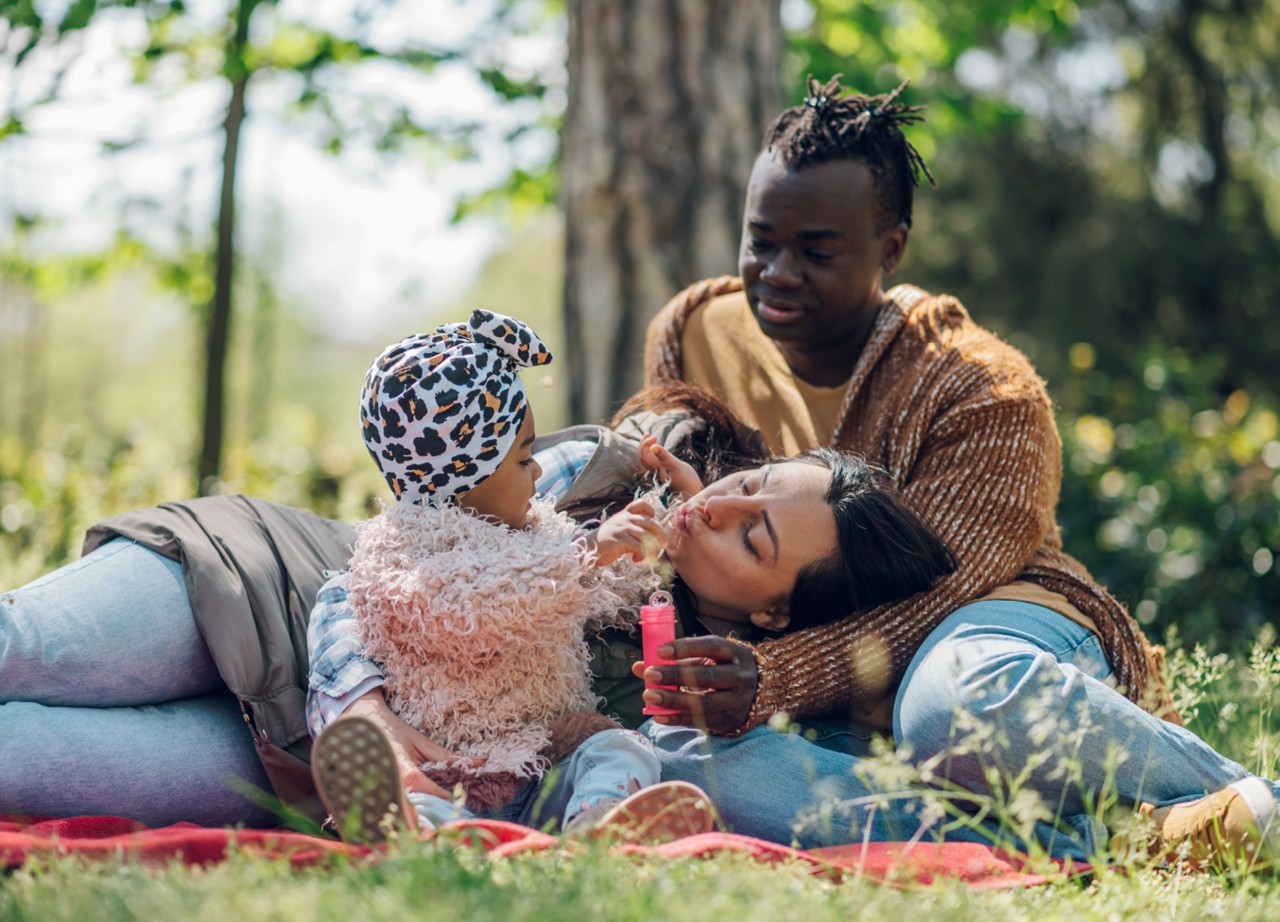 Family blowing bubbles