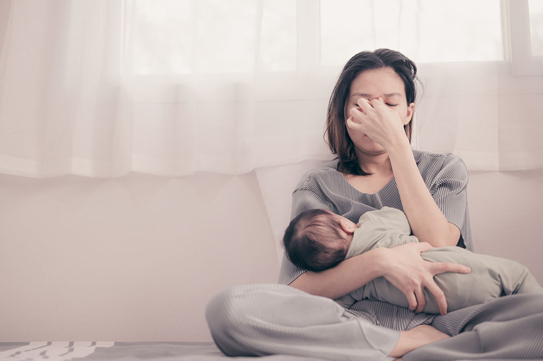 Tired Mother Suffering from experiencing postnatal depression.Health care single mom motherhood stressful. Tired Mother Suffering from experiencing postnatal depression.Health care single mom motherhood stressful.