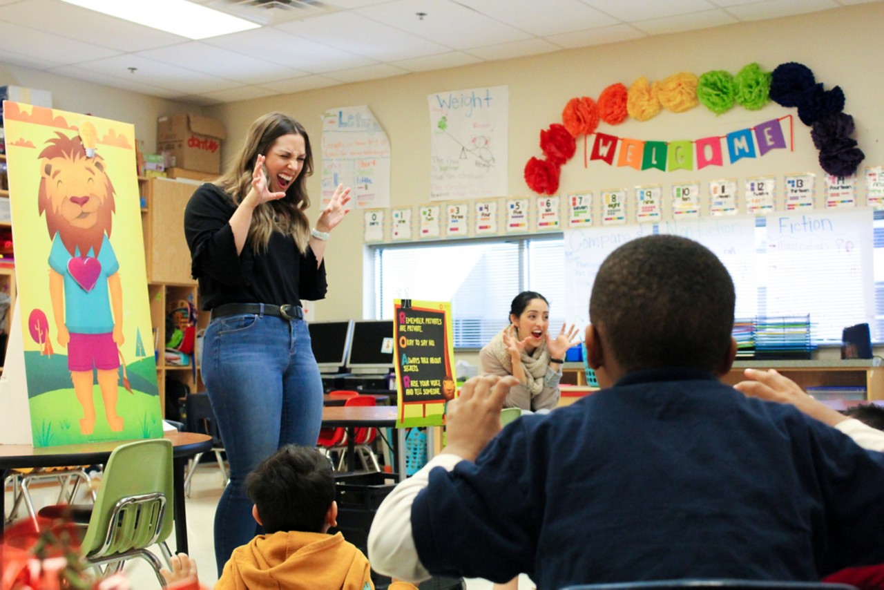 CARE Center Director of Education Shelby Lynch ROARs with students at Coolidge Elementary School in Oklahoma City.