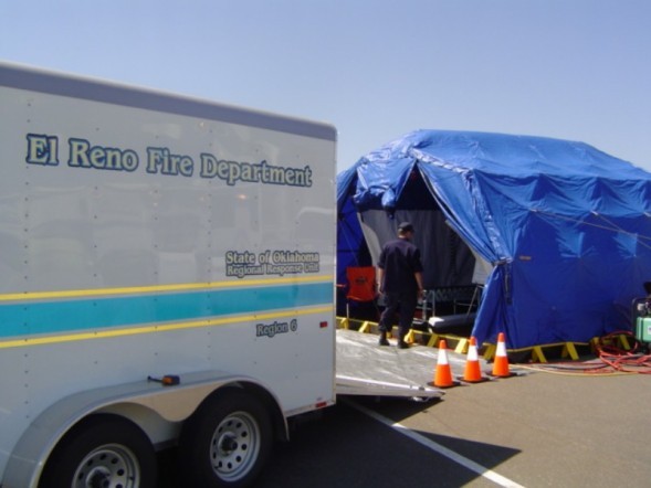 El Reno Fire Department trailer with ramp down and blue tent to store items