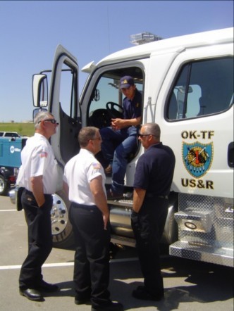 Urban Search Rescue Cab with four men talking