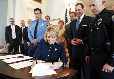 Governor Mary Fallen Signing OSSI into law