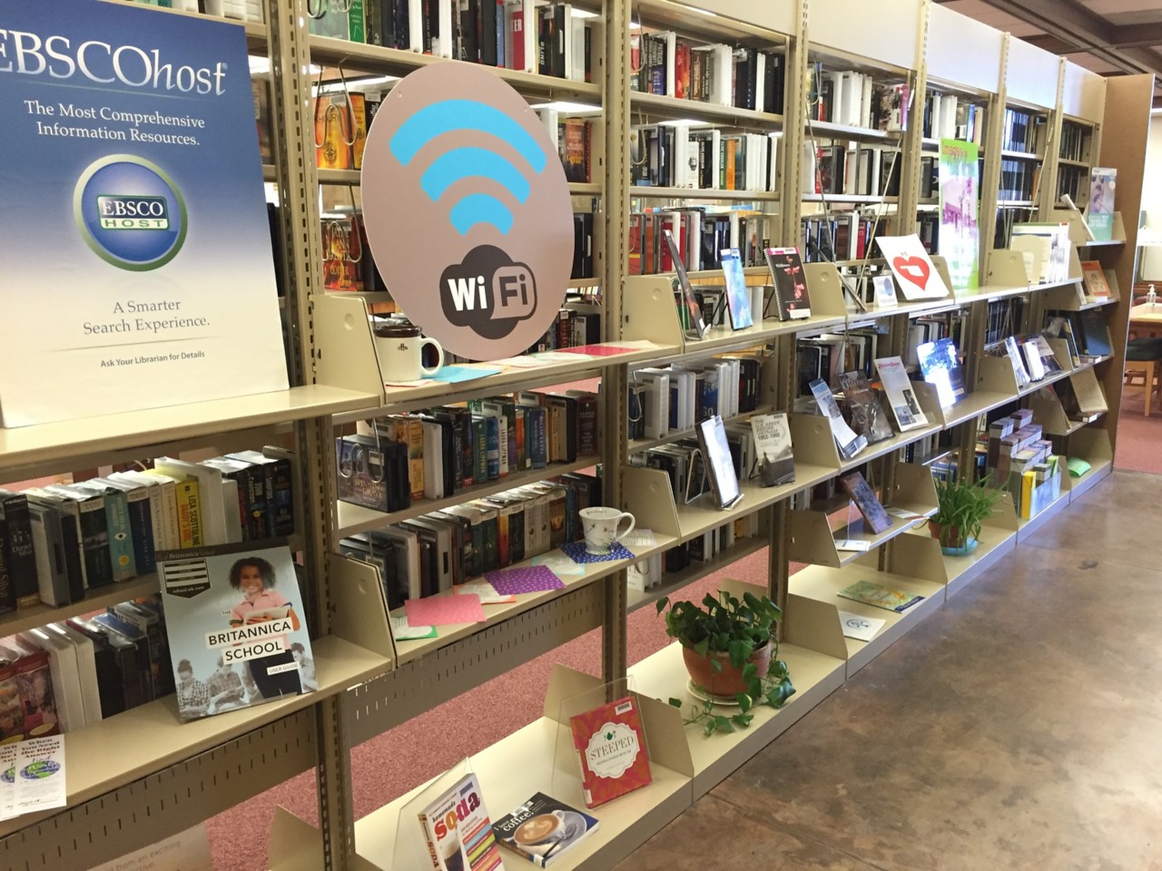 Shelves of Library Offerings including EBSCO and Wifi