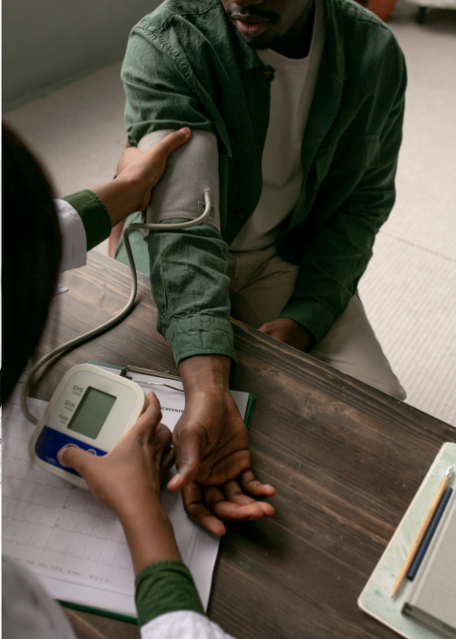 Doctor is checking on a patient's blood pressure