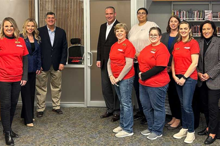 Group of individuals from Southern Oklahoma Libraries outside their telehealth booth