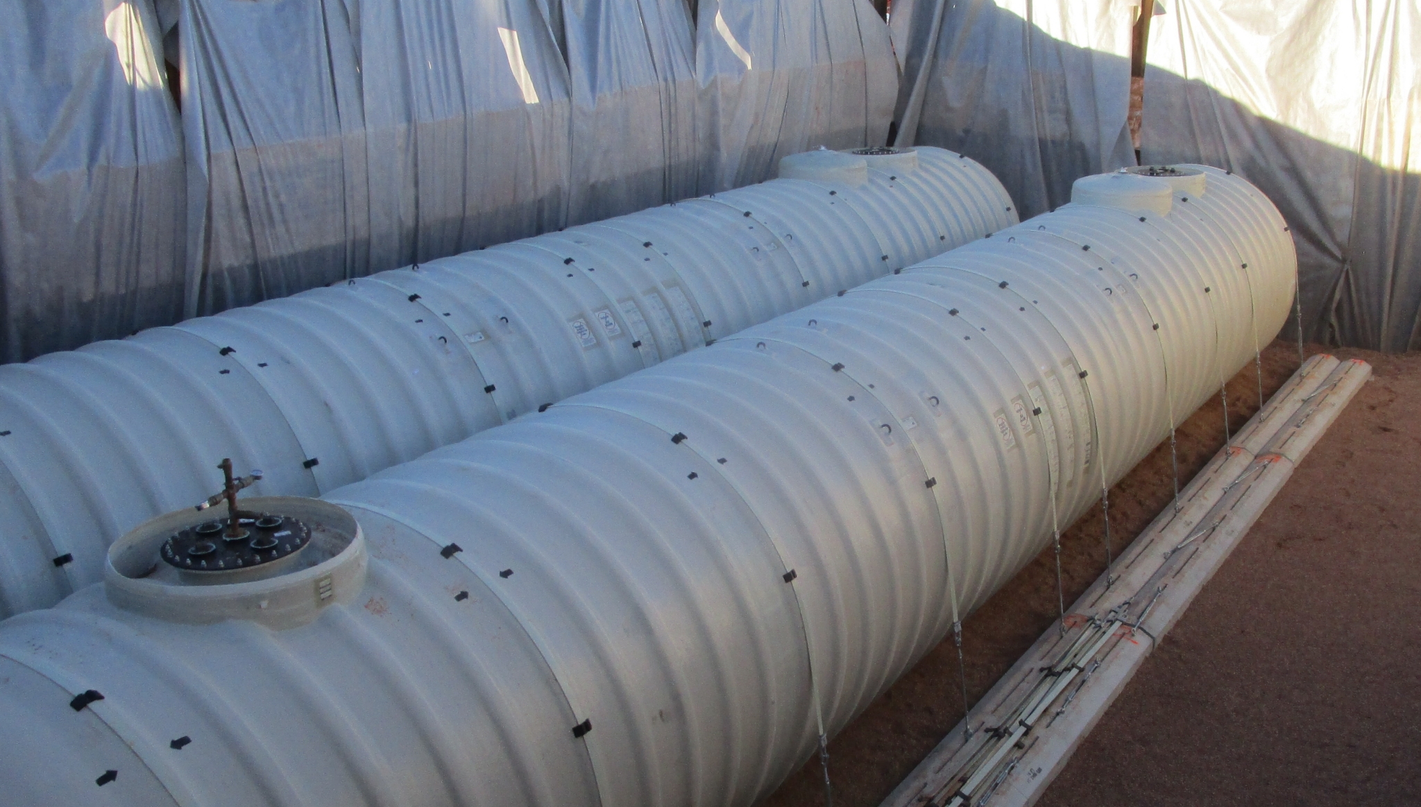 Large Underground Storage Tanks New large underground storage tanks sitting on flat surface