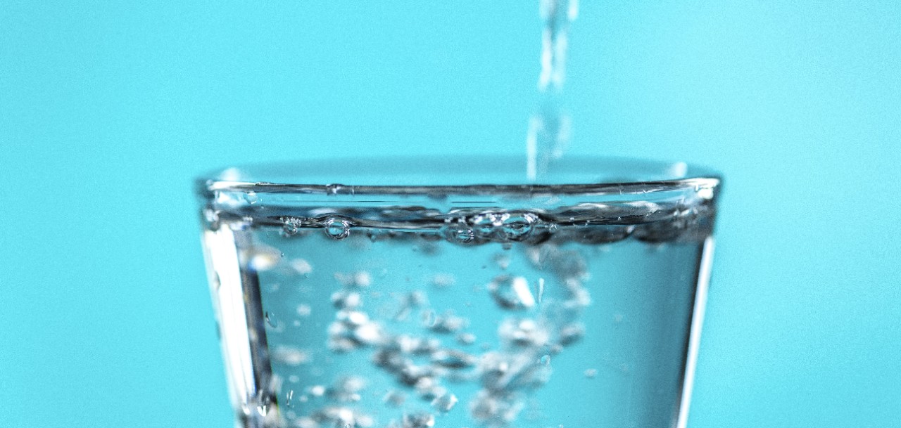 Close up of water being poured into a glass