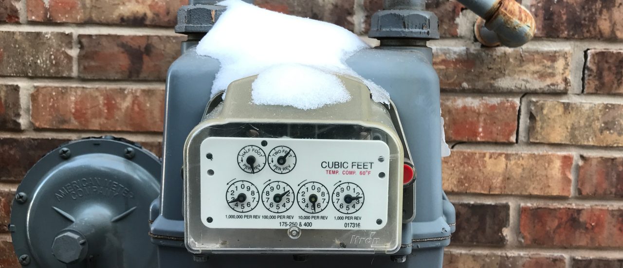 Snow is accumulated on top of a residential natural gas meter