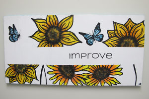Art project piece with word "Improve"