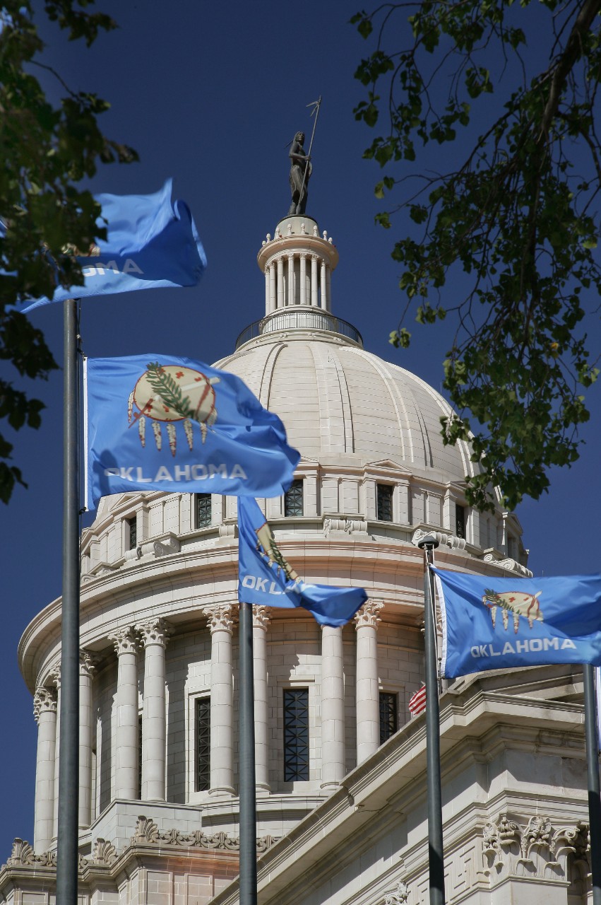 State of Oklahoma Capitol Building with State  flags in foreground