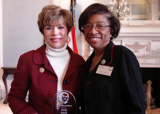 M Walker presenting the award to Sandy Garrett, State Superintendent of Public Instruction,  a Kate Barnard Recipient in 2010