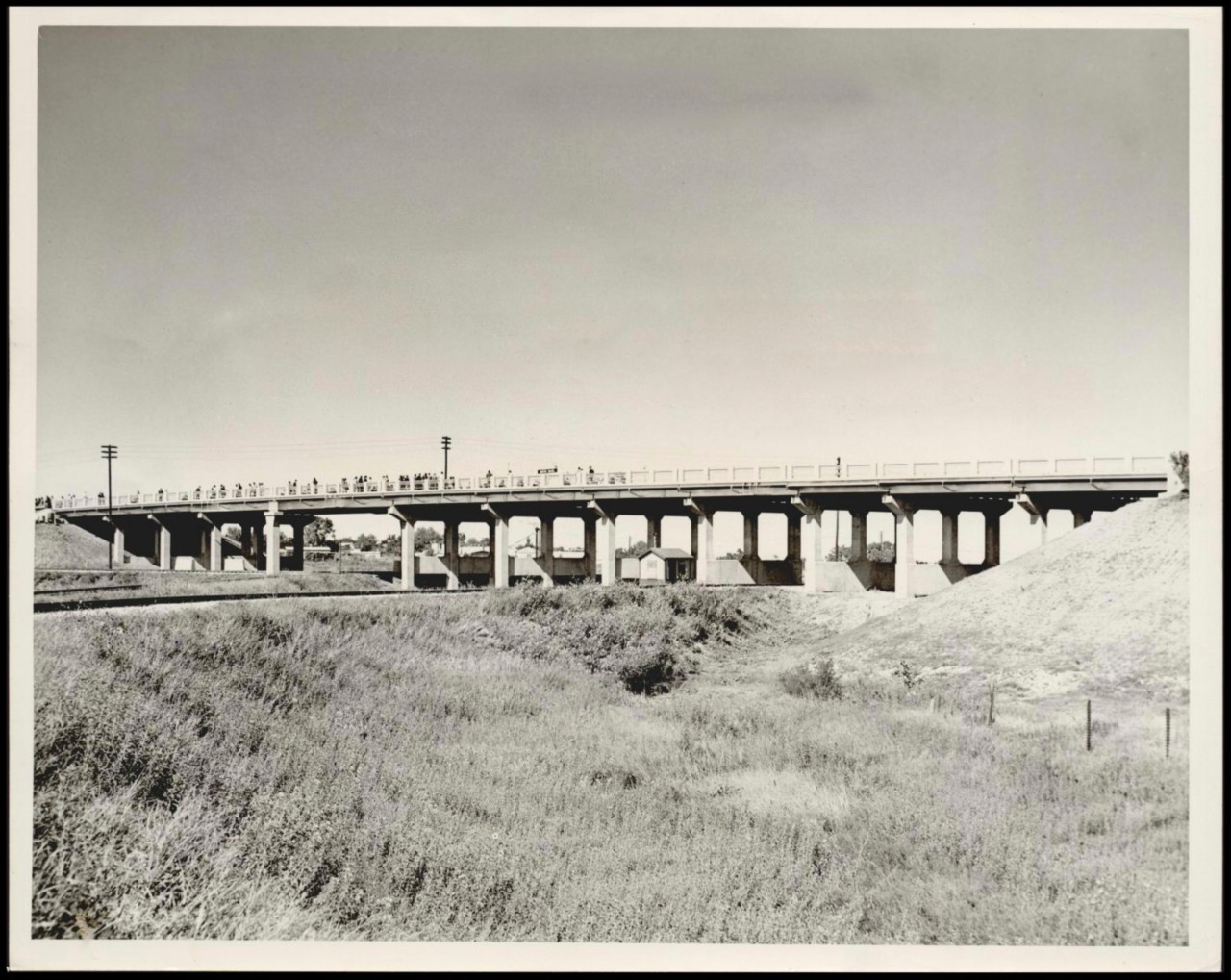 BRIDGES/ STATE / MISC : UNKNOWN: Caption reads, Traffic flowed Friday night over the US Highways 81 and 66 overpass over the Rock Island Railroad tracks intersection south of El Reno. Staff Photo by Richard Cobb. Original Photo 09/20/1946. Published on O-9-21-46.