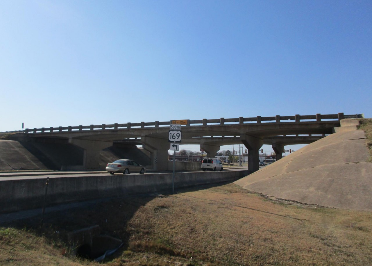 The US-169 bridges over 76th St. North in Owasso, with cars and trucks passing underneath
