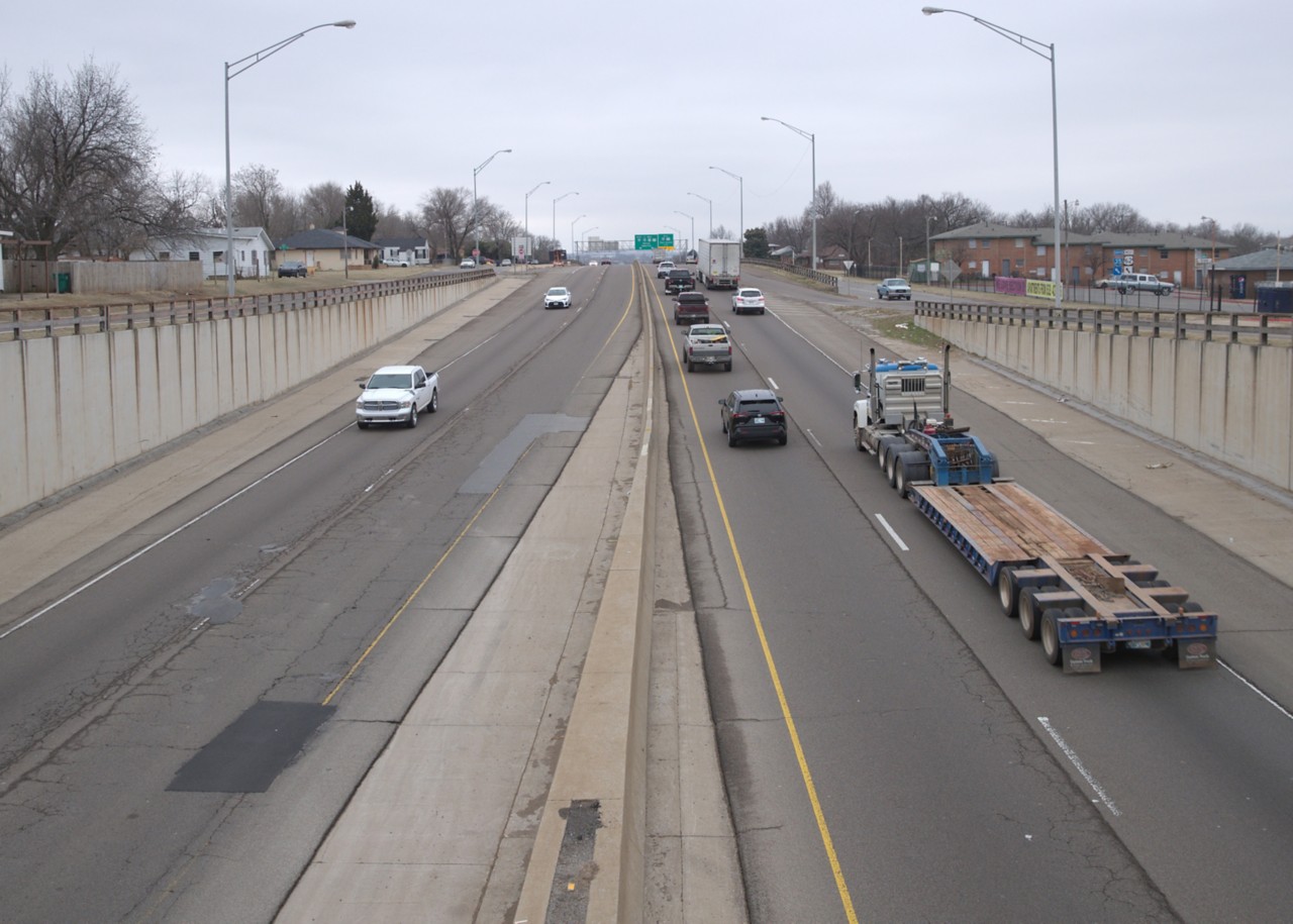 I-35 shown from N.E. 23rd St. with cars and trucking on the highway showing deteroirated pavement
