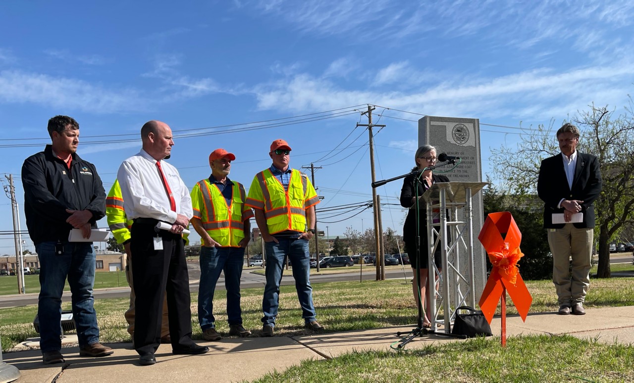 Oklahoma Department of Transportation Deputy Director Dawn Sullivan reads the names of ODOT's 61 fallen workers during a Moment of Silence ceremony for workers at the end of National Work Zone Awareness Week. She was joined by Secretary of Transportation Tim Gatz, right, ODOT Director of Operations Shawn Davis, left, and Oklahoma Turnpike Authority Deputy Director Joe Echelle, far left, along with OTA maintenance workers Kenny Baker and Jeremy Smart. Echelle read the names of OTA's 11 fallen workers.