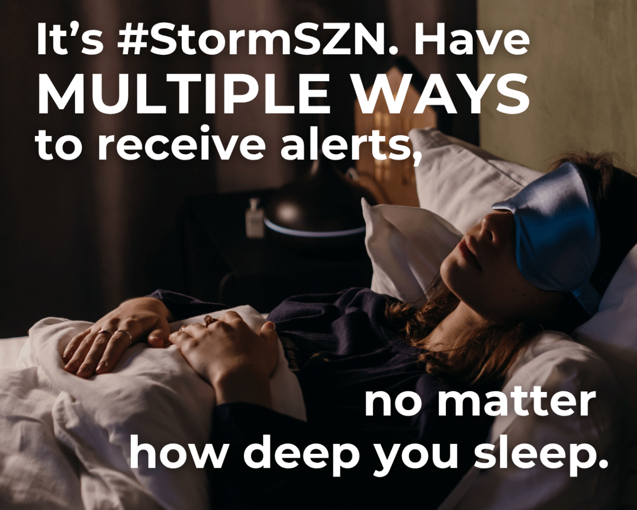 It's #StormSZN. Have Multiple ways to receive alerts, no matter how deep you sleep. Image of a woman in bed with sleep mask on. Logo, OEM. 