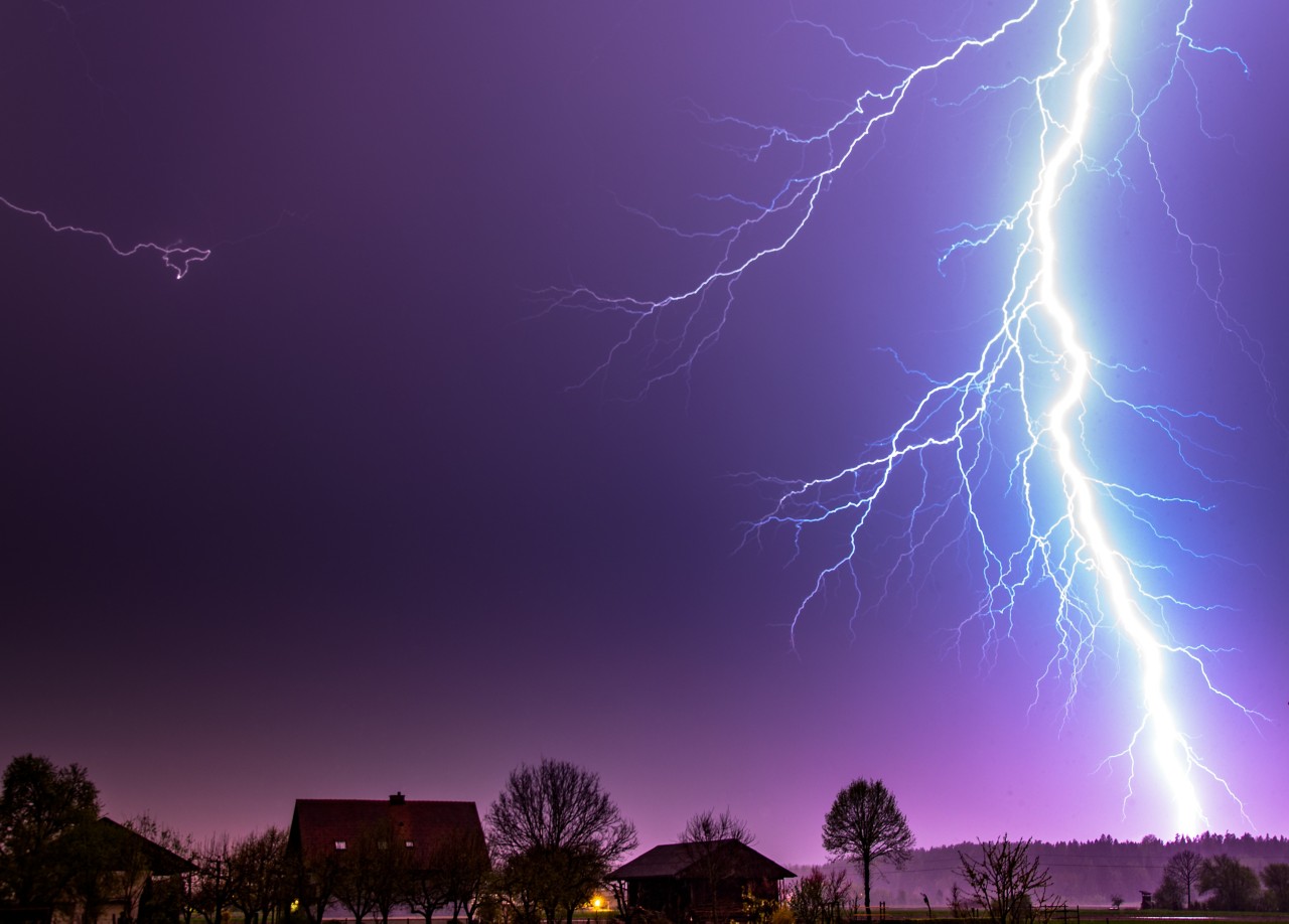 Powerful lightning during thunderstorm in rural area
