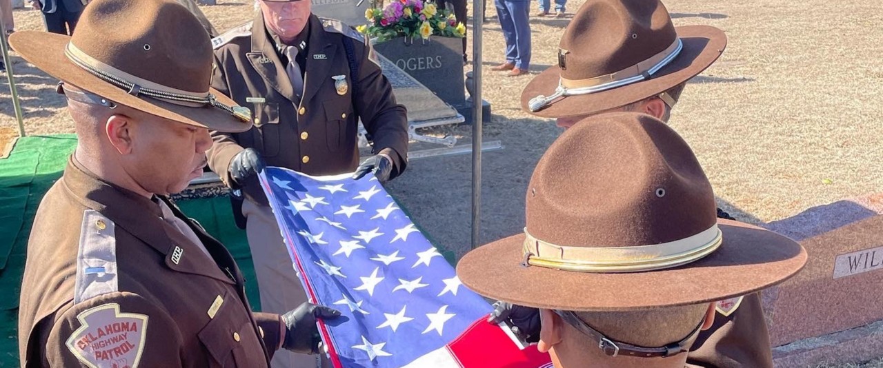 Troopers folding flag