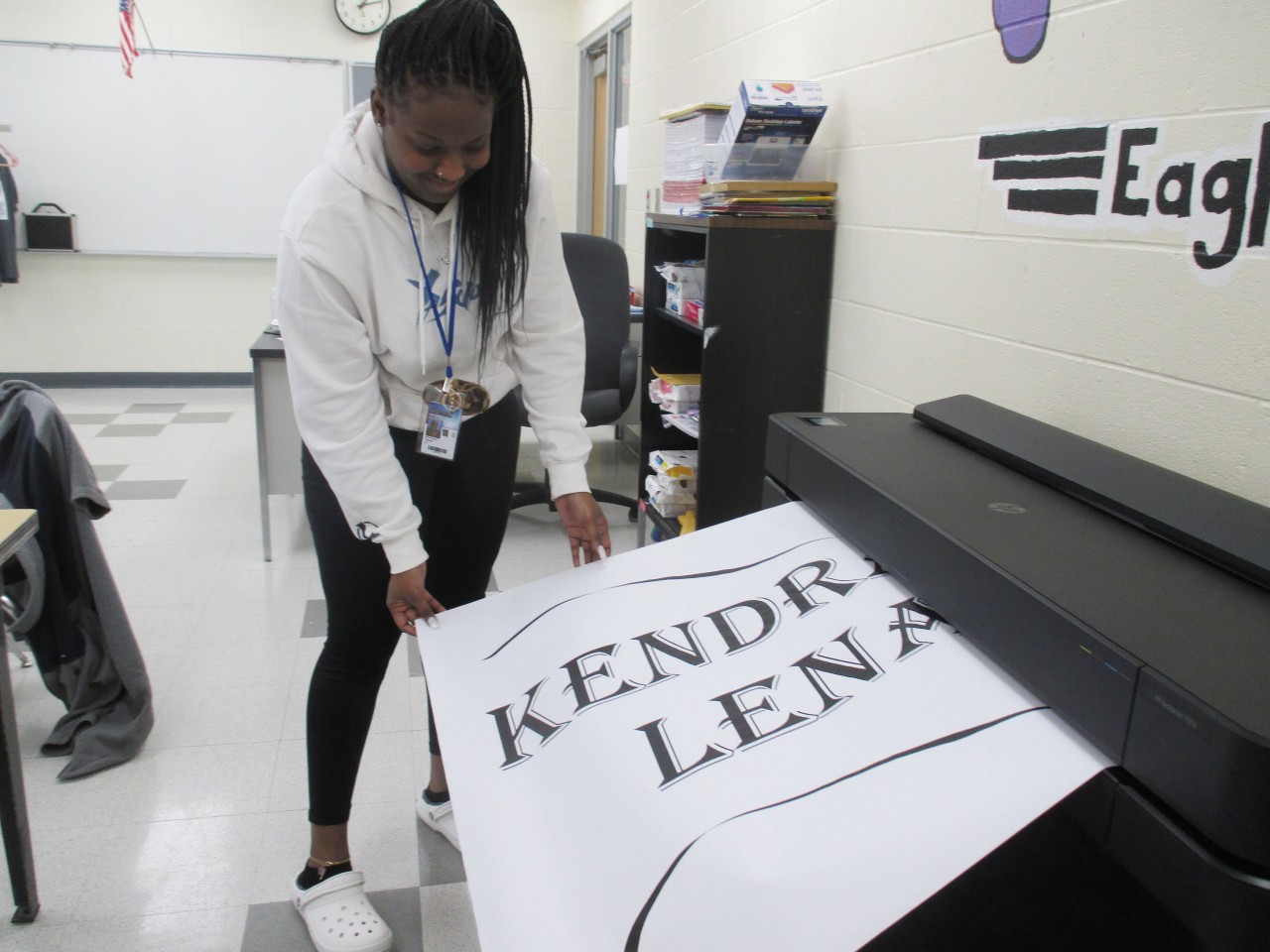 Student using poster printer.