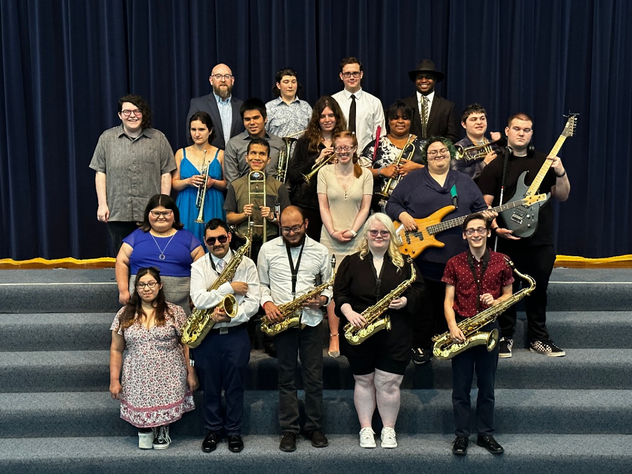 OSB Jazz Band, a group of 19 students holding their instruments and the band director.