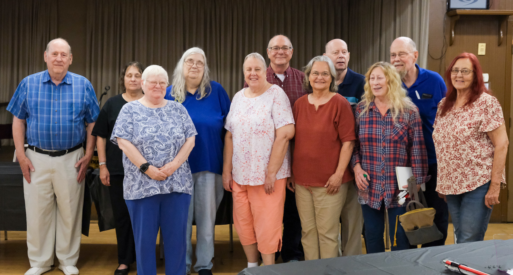 The 2024 OSLS Board Members. The board of OSLS, group of 11 individuals smiling for the camera.