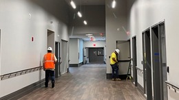 Sallisaw Veterans Home Two construction workers in unfinished hallway at the Sallisaw Veterans Home