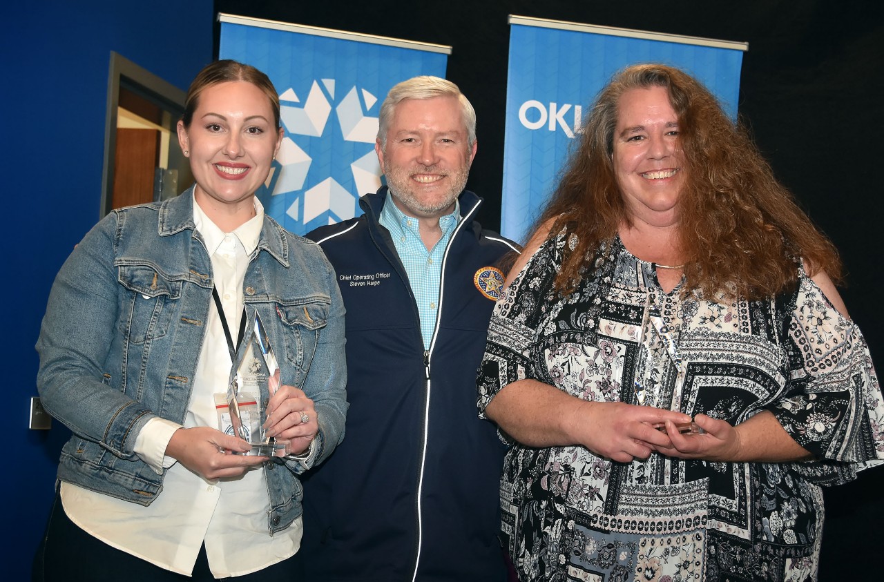 Photo of managers of the year Sophie Preston and Denise White with Chief Operating Officer and OMES Executive Director Steven Harpe