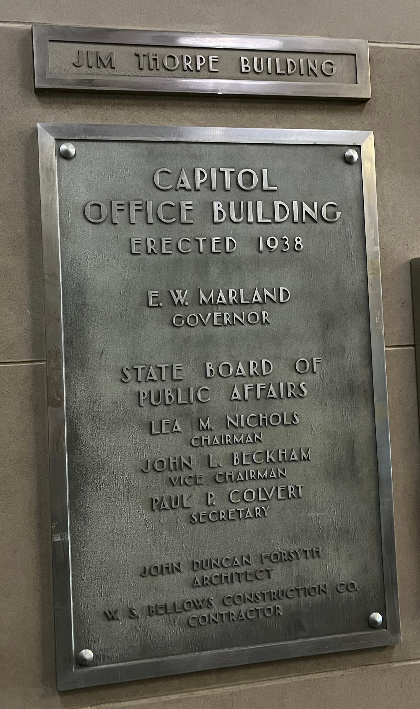 Jim Thorpe Building plaque from inside the building. The plaque reads "Capitol Office Building - erected 1938. E.W. Marland Governor."
