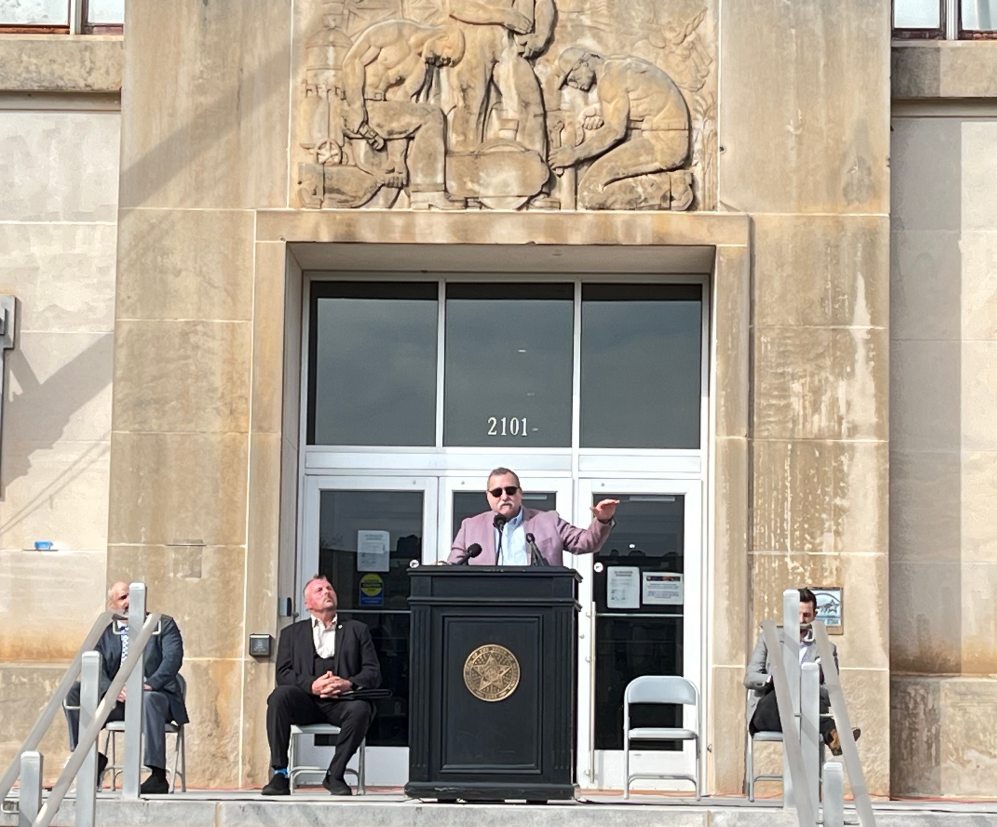 Oklahoma House Rep. Mark McBride gives a speech on the front stairs of the Jim Thorpe Building.