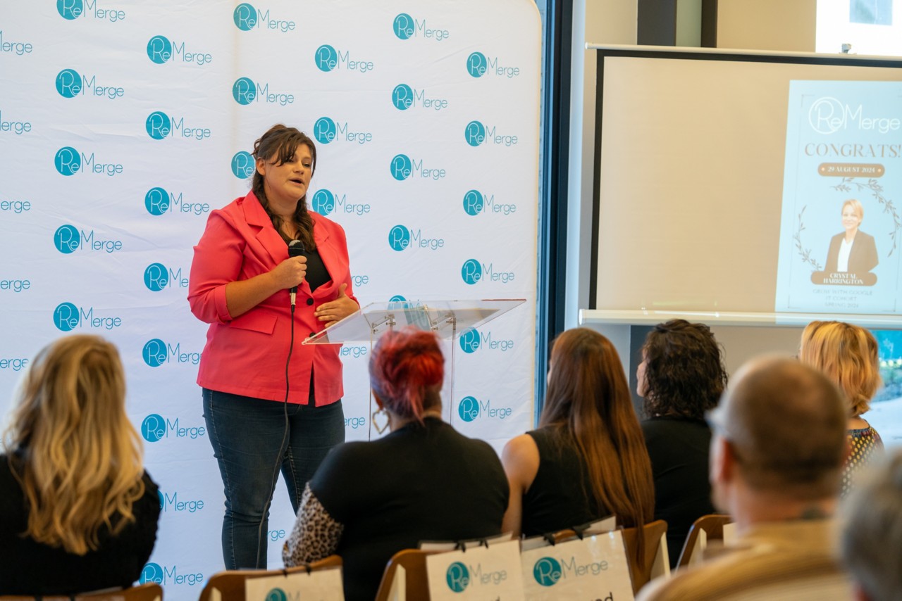 Samantha Rooney addressing new graduates of the ReMerge Career Pathway Program.