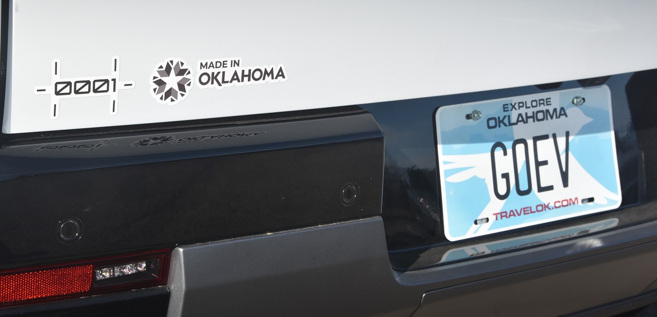 Made-in-Oklahoma sticker on a State of Oklahoma Canoo vehicle trunk.