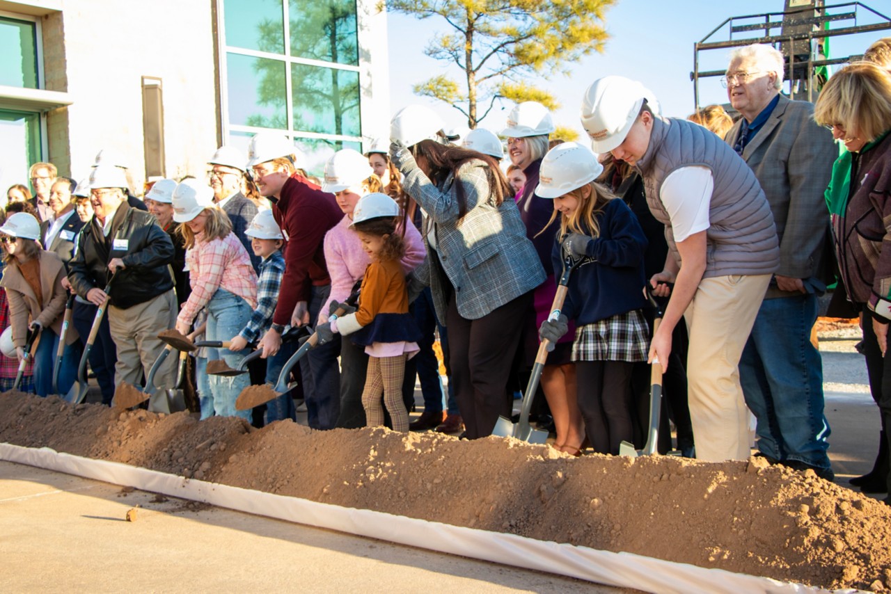 Hearts for Hearing patients and guests participate in the ceremonial groundbreaking at  site of the expansion project.
