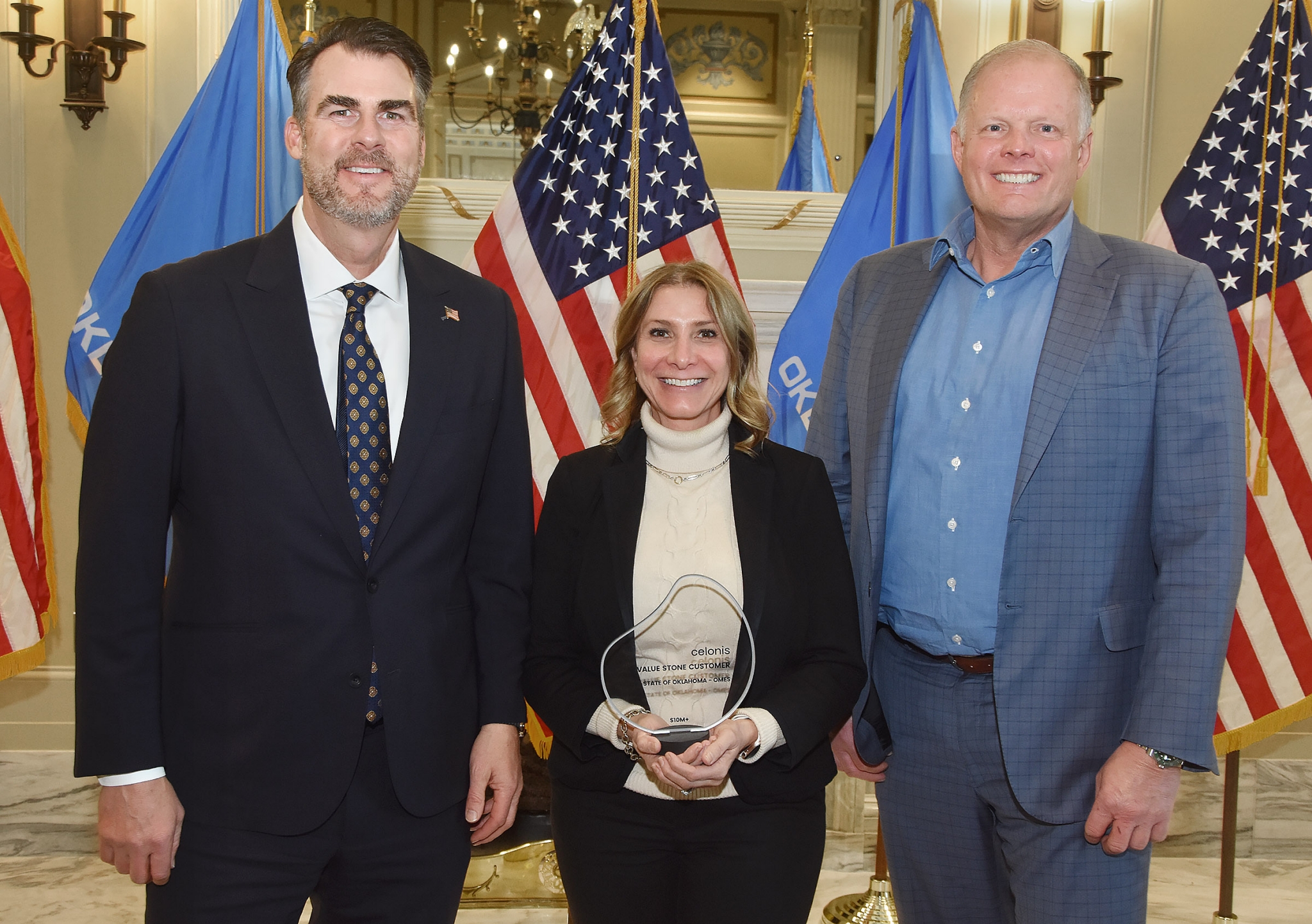 From left to right: Gov. Kevin Stitt; OMES Director of Risk, Assessment and Compliance Janet Morrow; and Tom Novosel with Celonis. From left to right: Gov. Kevin Stitt; OMES Director of Risk, Assessment and Compliance Janet Morrow; and Tom Novosel with Celonis.
