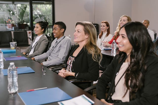 Decorative image of people attending a training course