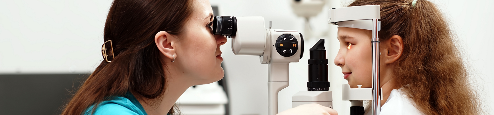 2479049341 Examination of the child using a slit lamp. Microscope and focused light source. A device for high-precision examination of the eye to determine the condition of the lens.