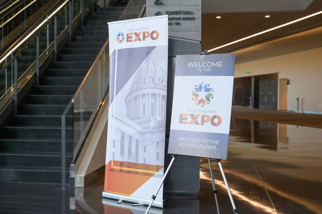 Expo directional sign and banner on first floor by escalators