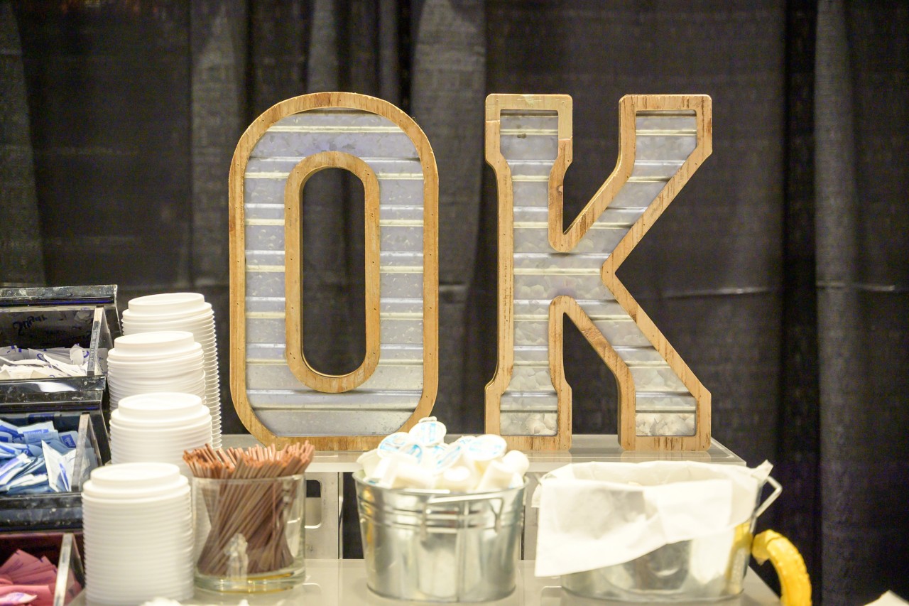 Metal and wood OK letters at coffee station.
