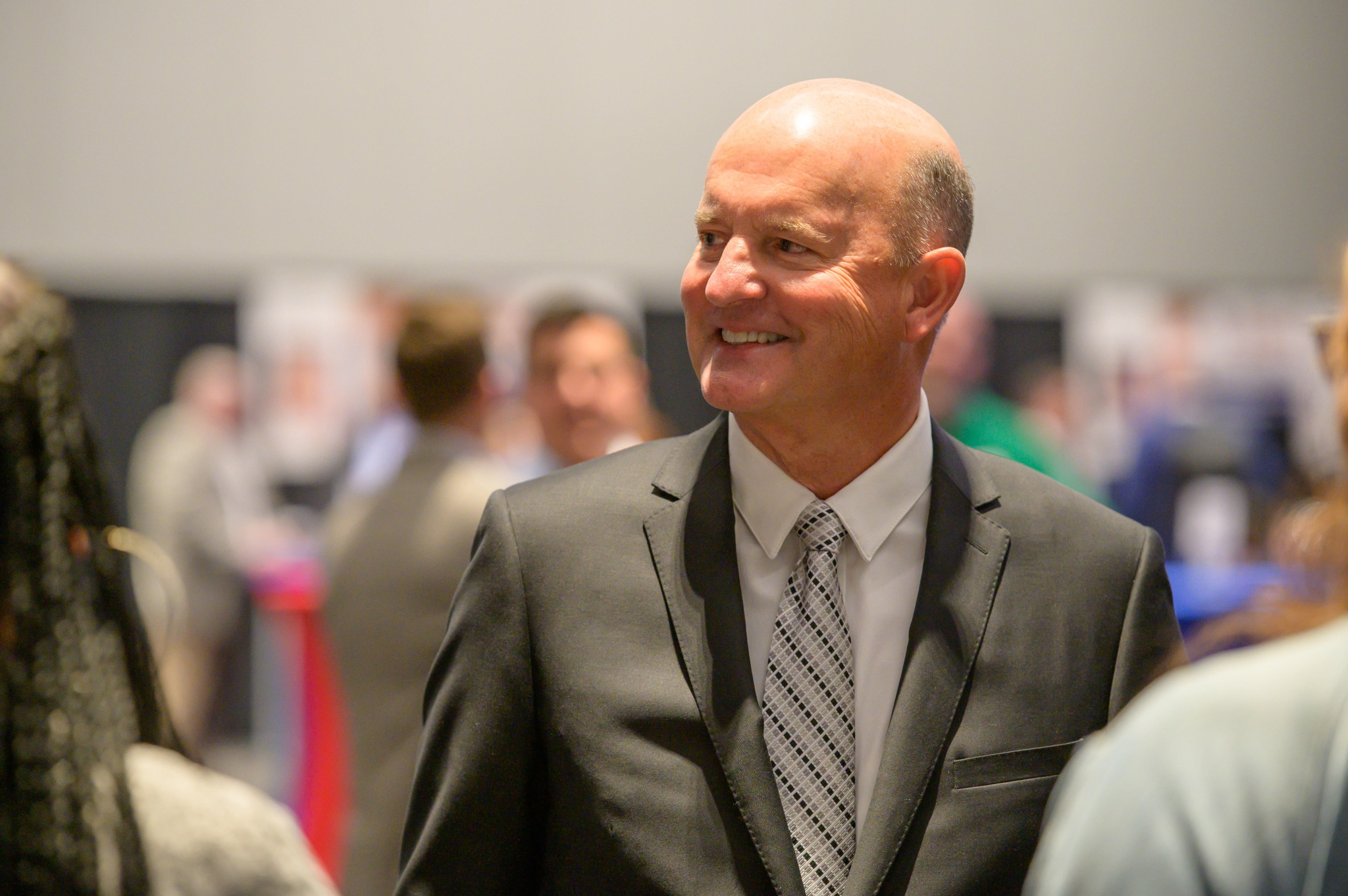 State Chief Operating Officer John Suter smiling.