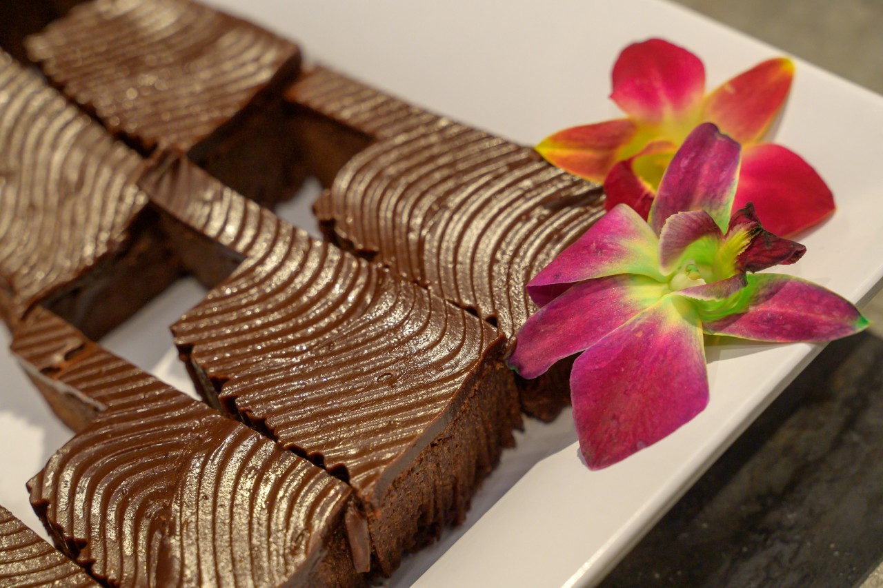 Oklahoma-shaped brownies and orchid garnish.