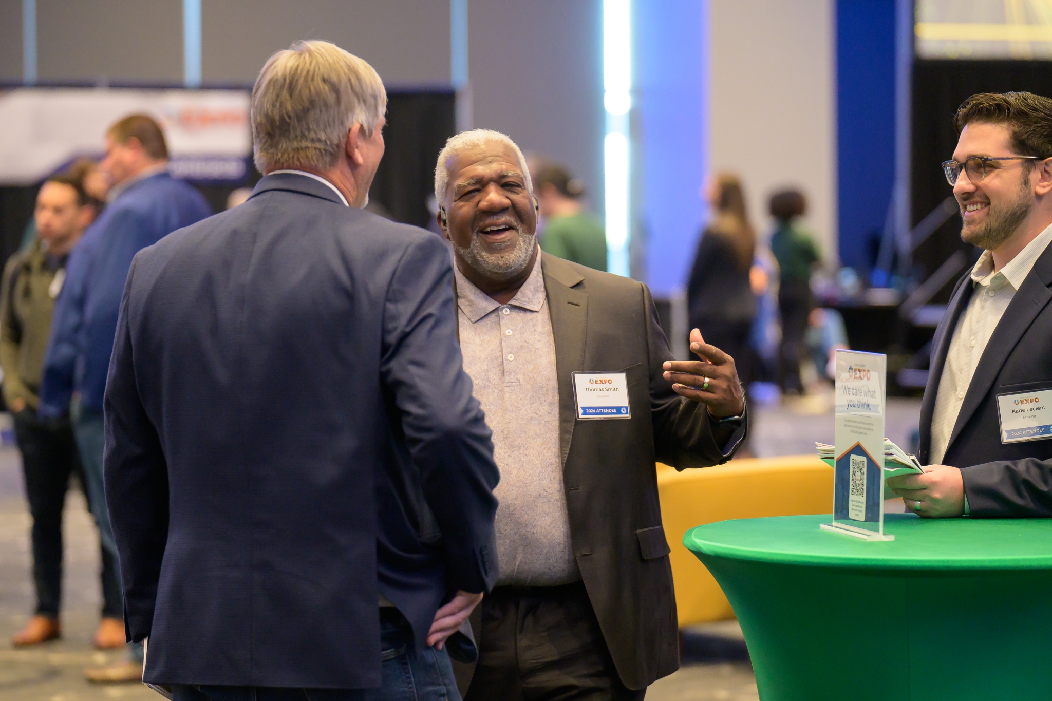 Three attendees laughing together